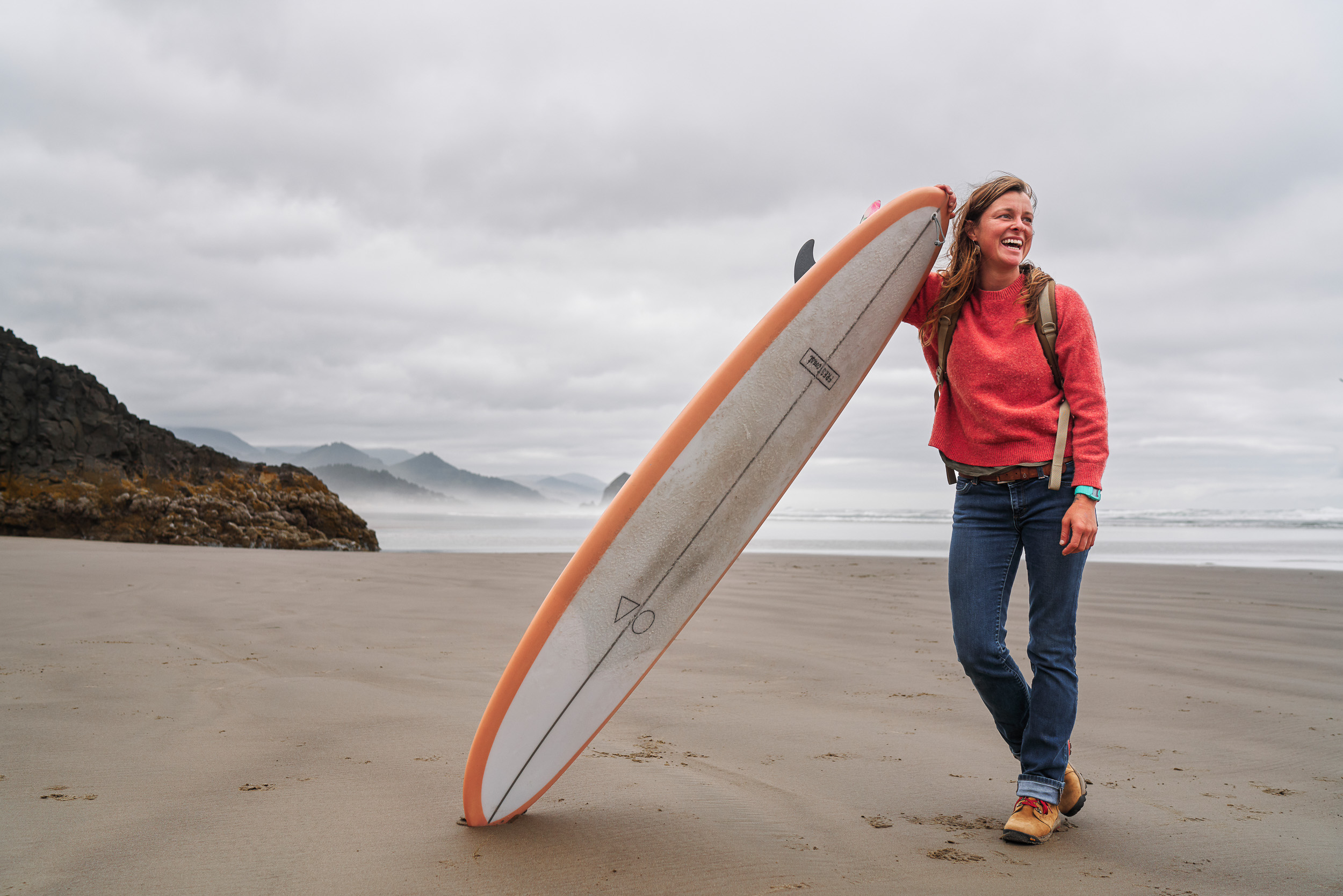 Lauren Ahlgren of Oregon Surf Adventures wearing Danner Inquires on Cannon Beach, OR