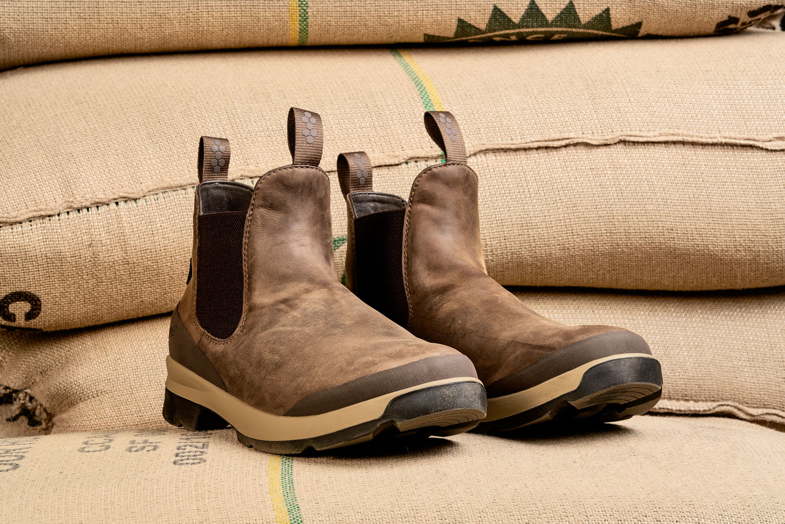 Product photo of the Danner Pub Garden on sacks of un roasted coffee at Coava 