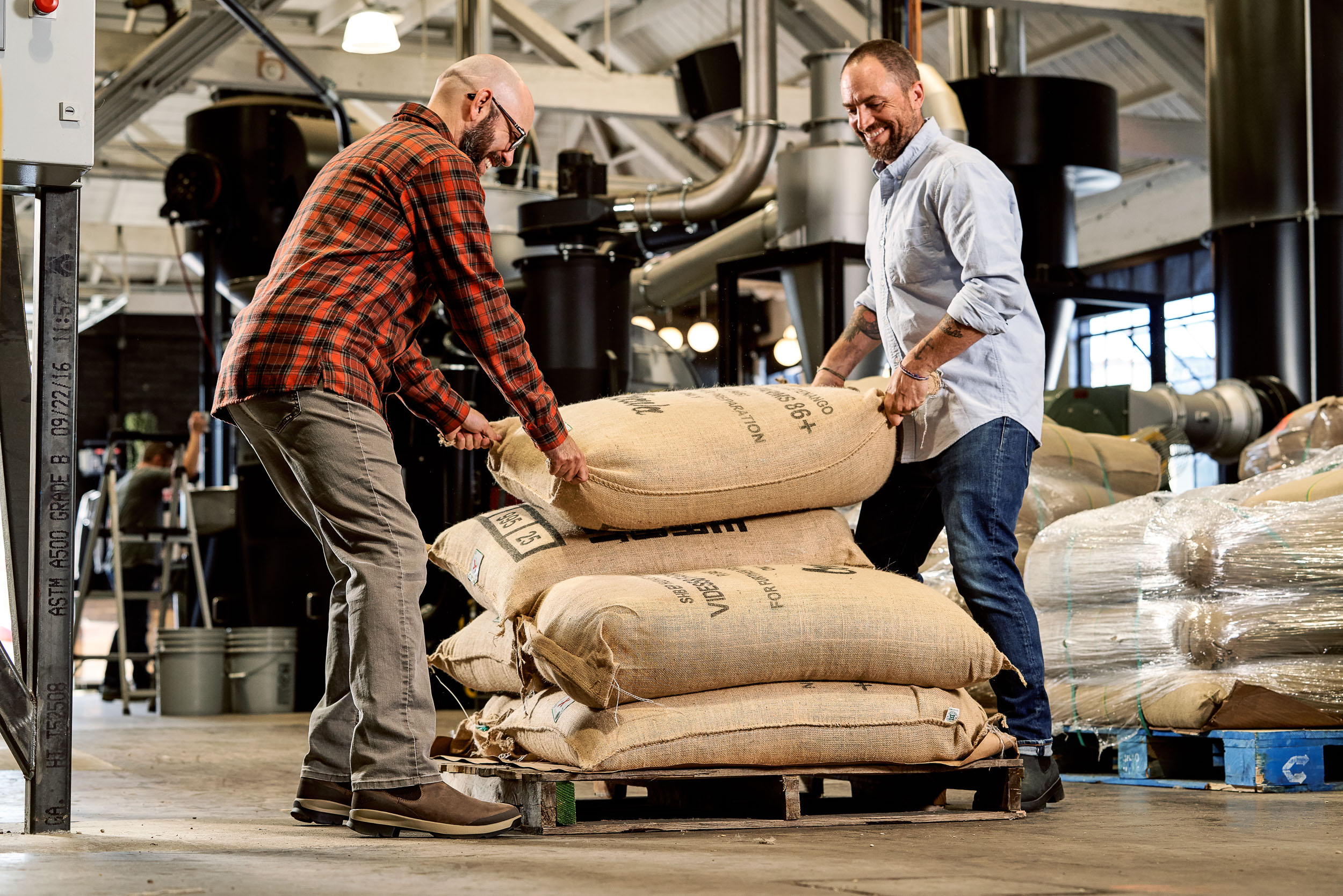 Moving sacks of green coffee at Coava Roasters in Portland, OR while wearing Danner Pub Gardens